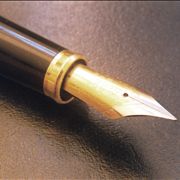 Picture Of Quill Pen Over A Leather Notepad